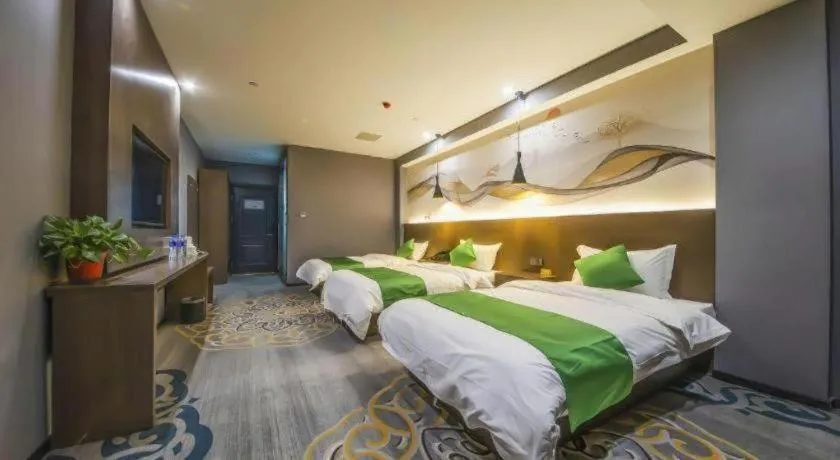 Bed in Shell Hotel Zhengzhou East High-Speed Railway Station Zhengdong Commerical Center
