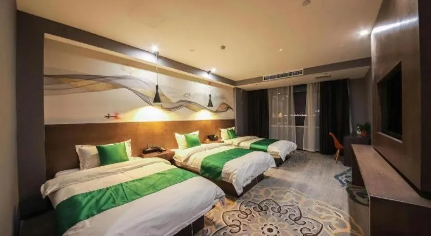 Bed in Shell Hotel Zhengzhou East High-Speed Railway Station Zhengdong Commerical Center