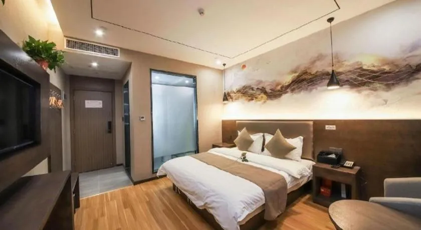 Bed in Shell Hotel Zhengzhou East High-Speed Railway Station Zhengdong Commerical Center
