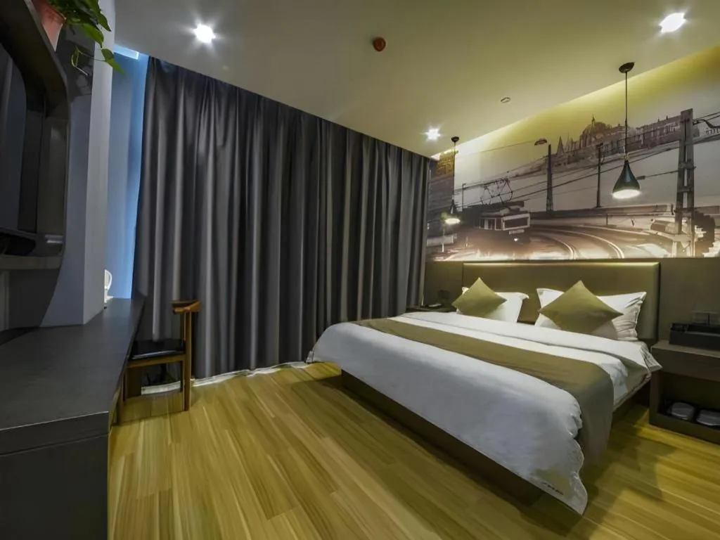Bed in Shell Hotel Zhengzhou East High-Speed Railway Station Zhengdong Commerical Center