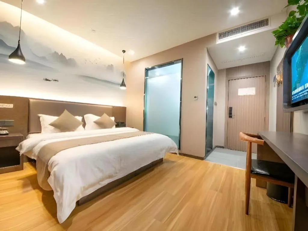 Bed in Shell Hotel Zhengzhou East High-Speed Railway Station Zhengdong Commerical Center