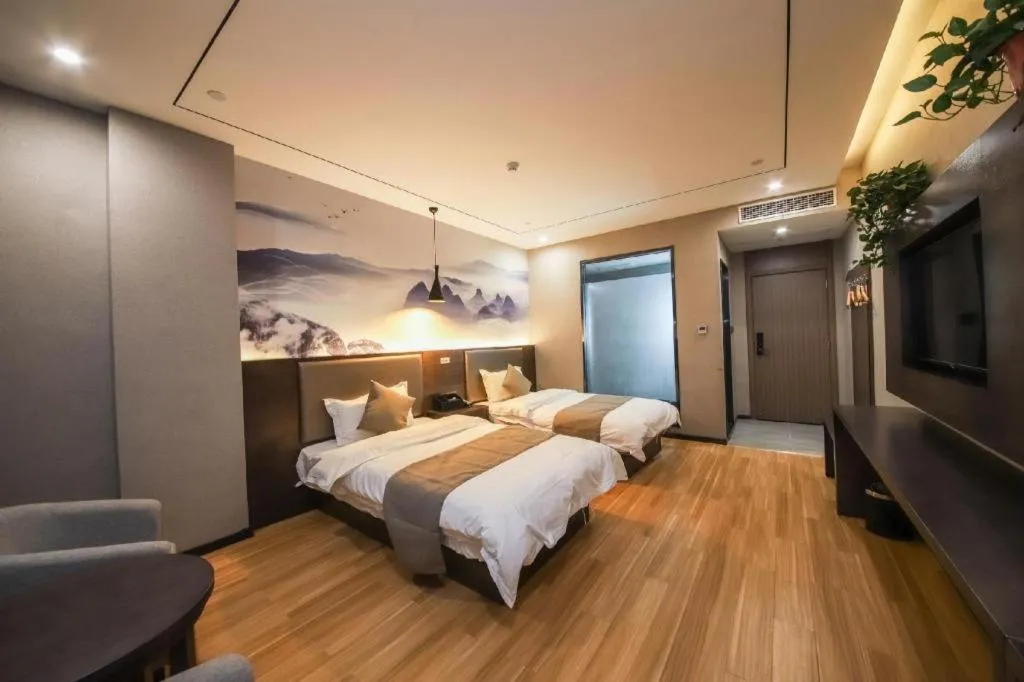 Bed in Shell Hotel Zhengzhou East High-Speed Railway Station Zhengdong Commerical Center