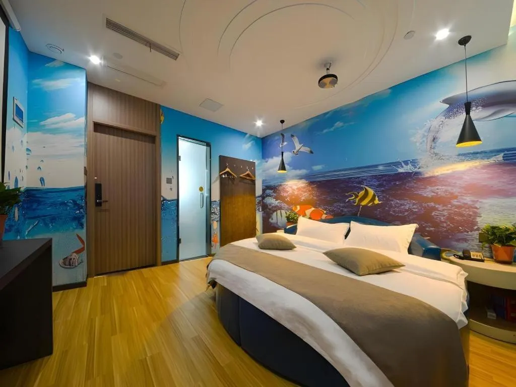 Bed in Shell Hotel Zhengzhou East High-Speed Railway Station Zhengdong Commerical Center