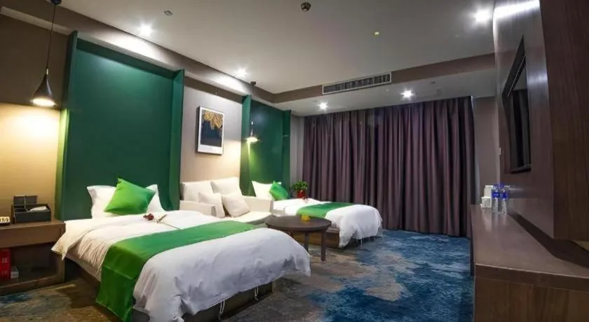 Bed in Shell Hotel Zhengzhou East High-Speed Railway Station Zhengdong Commerical Center