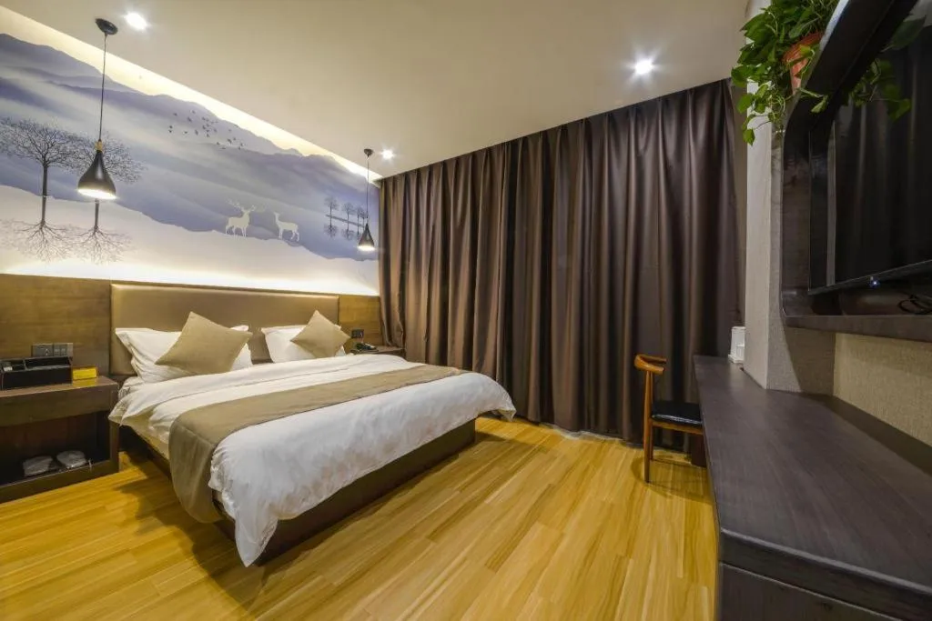 Bed in Shell Hotel Zhengzhou East High-Speed Railway Station Zhengdong Commerical Center