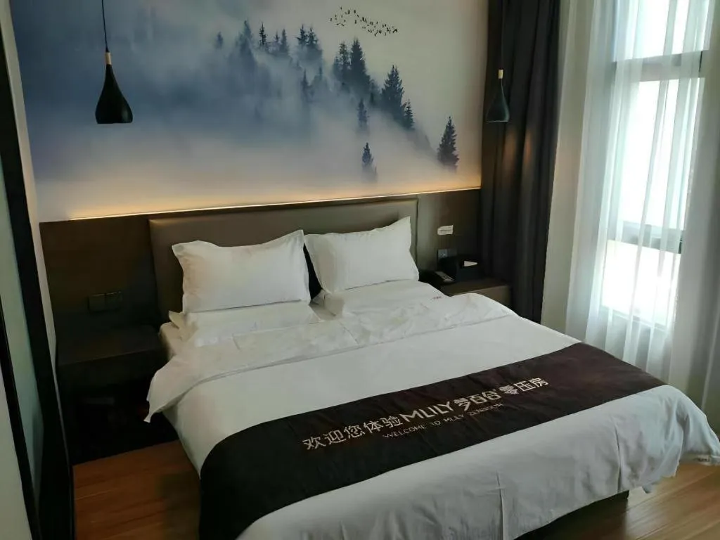 Bed in Shell Hotel Zhengzhou East High-Speed Railway Station Zhengdong Commerical Center