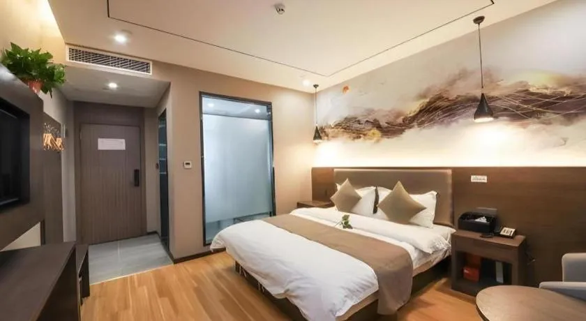 Bed in Shell Hotel Zhengzhou East High-Speed Railway Station Zhengdong Commerical Center