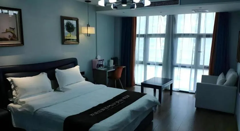 Bed in Shell Hotel Zhengzhou East High-Speed Railway Station Zhengdong Commerical Center
