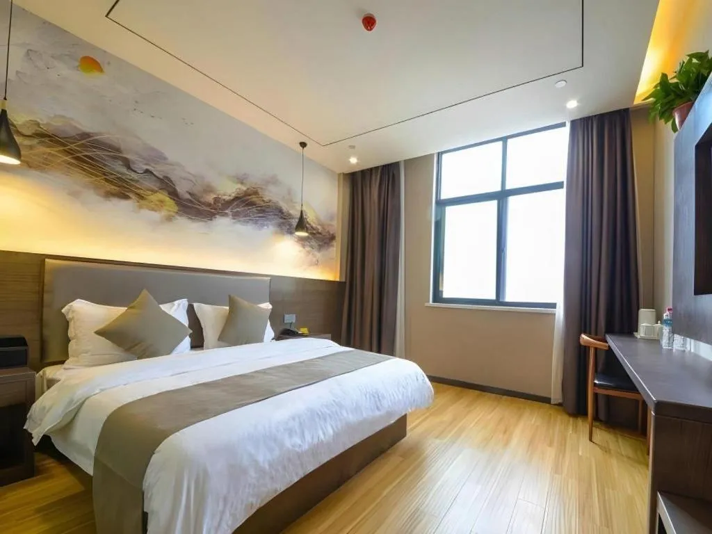 Bed in Shell Hotel Zhengzhou East High-Speed Railway Station Zhengdong Commerical Center