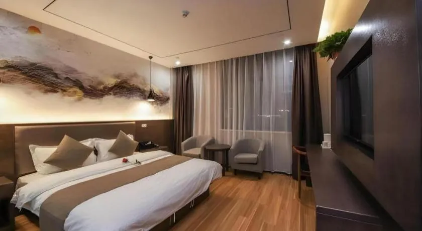 Bed in Shell Hotel Zhengzhou East High-Speed Railway Station Zhengdong Commerical Center