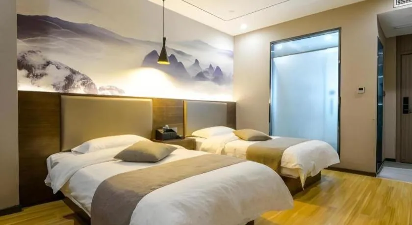Bed in Shell Hotel Zhengzhou East High-Speed Railway Station Zhengdong Commerical Center