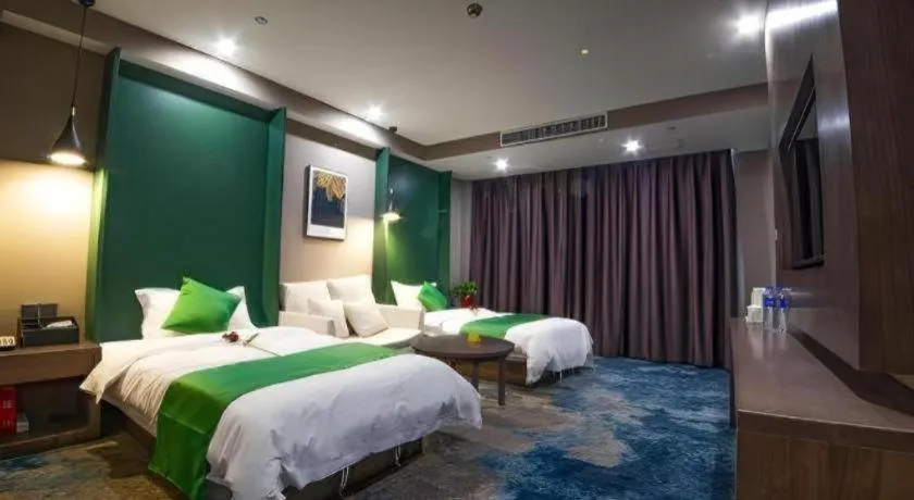 Bed in Shell Hotel Zhengzhou East High-Speed Railway Station Zhengdong Commerical Center