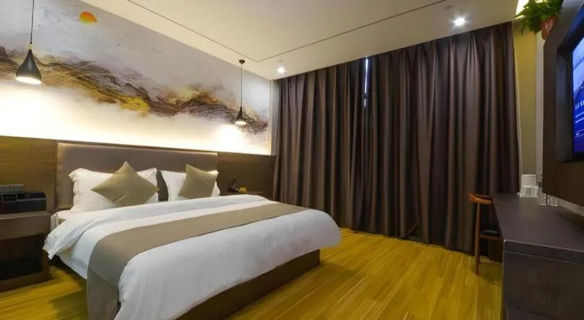 Bed in Shell Hotel Zhengzhou East High-Speed Railway Station Zhengdong Commerical Center