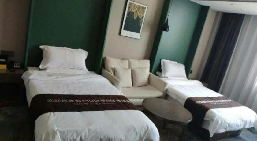 Bed in Shell Hotel Zhengzhou East High-Speed Railway Station Zhengdong Commerical Center