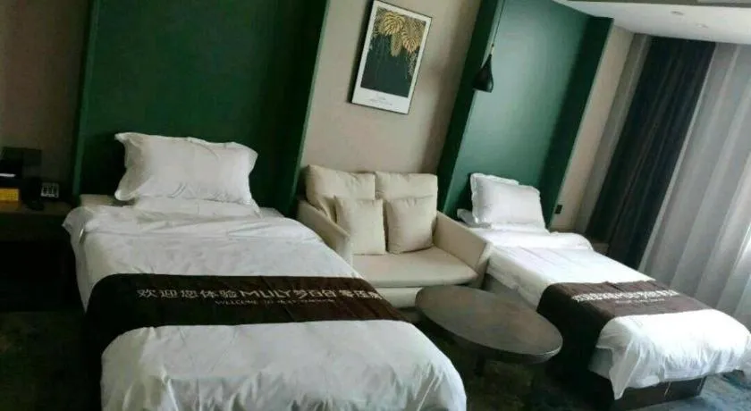 Bed in Shell Hotel Zhengzhou East High-Speed Railway Station Zhengdong Commerical Center