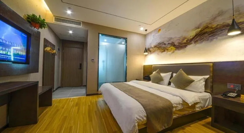 Bed in Shell Hotel Zhengzhou East High-Speed Railway Station Zhengdong Commerical Center