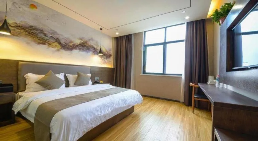 Bed in Shell Hotel Zhengzhou East High-Speed Railway Station Zhengdong Commerical Center
