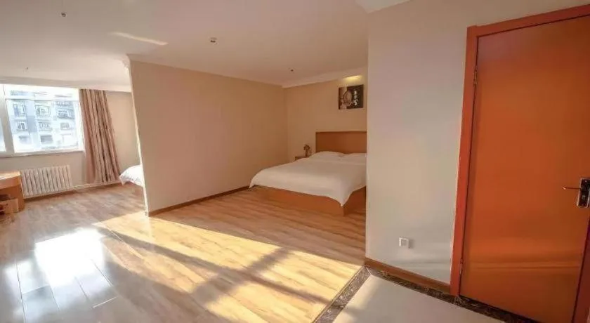 Bed in GreenTree Inn Dalian Jinzhou District Railway Station Ansheng Plaza