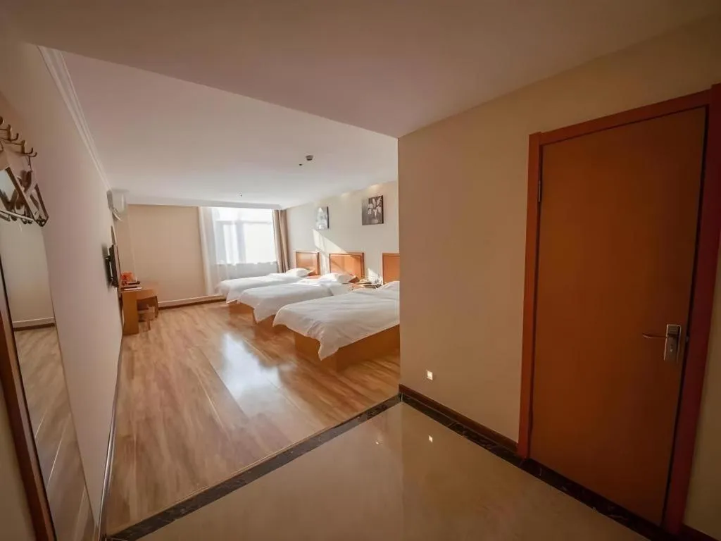 Bed in GreenTree Inn Dalian Jinzhou District Railway Station Ansheng Plaza