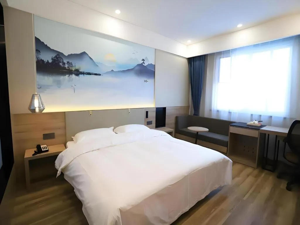 Bed in VX Hotel Jiangsu Taizhou Xinghua RT-Mart