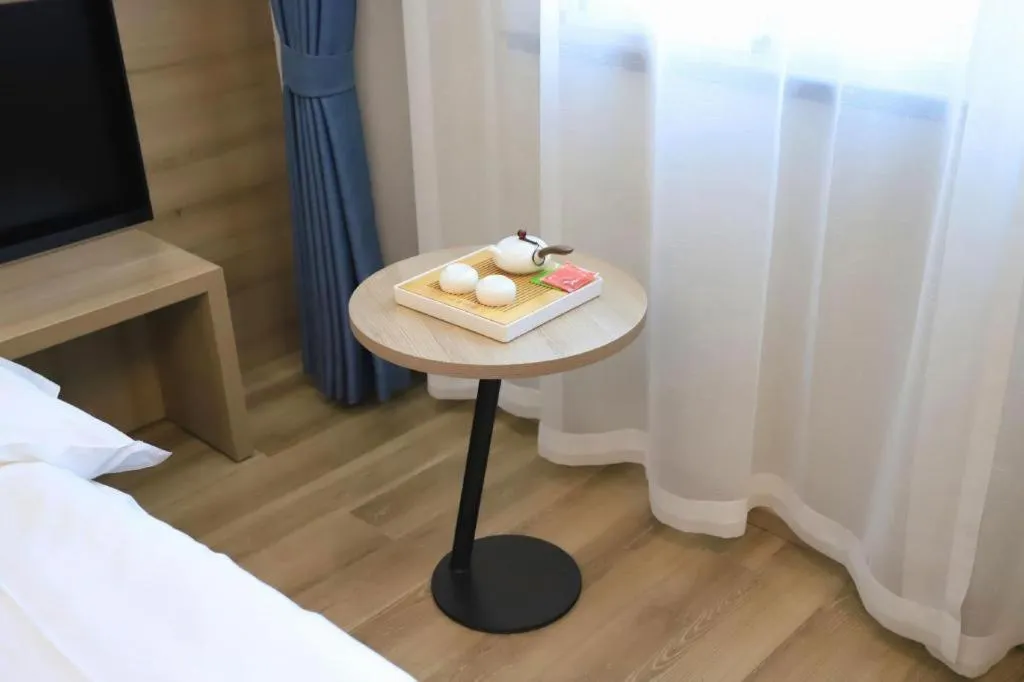 Bed in VX Hotel Jiangsu Taizhou Xinghua RT-Mart