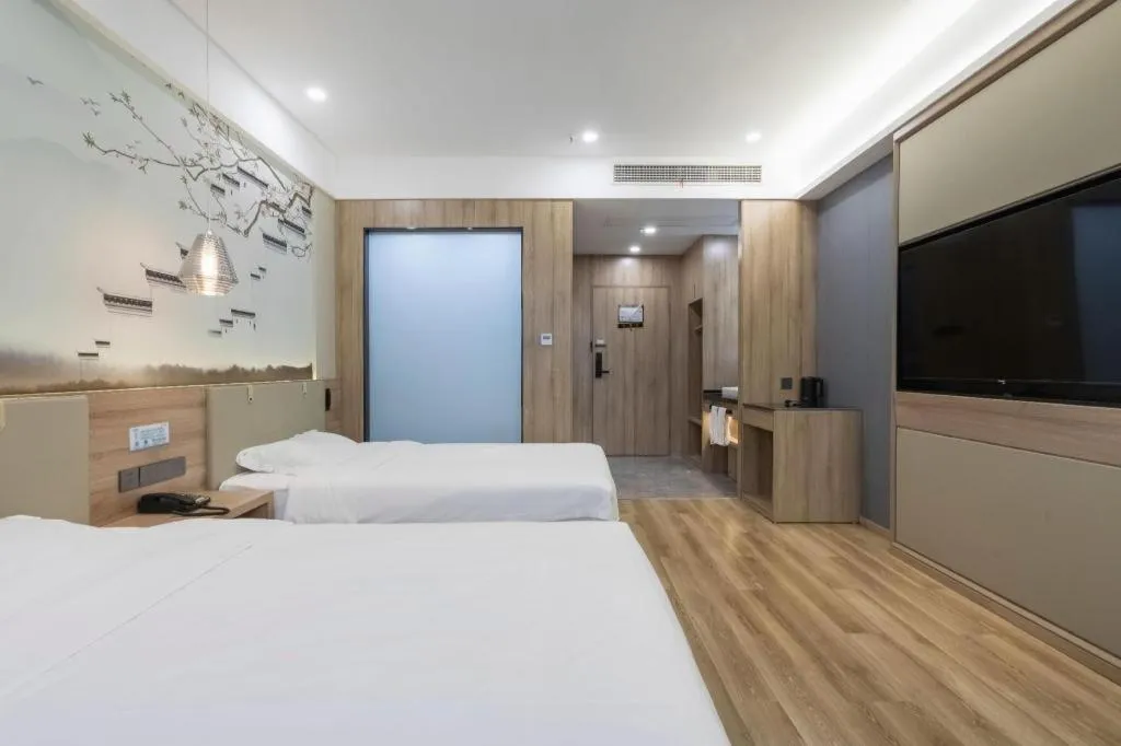 Bed in VX Hotel Jiangsu Taizhou Xinghua RT-Mart