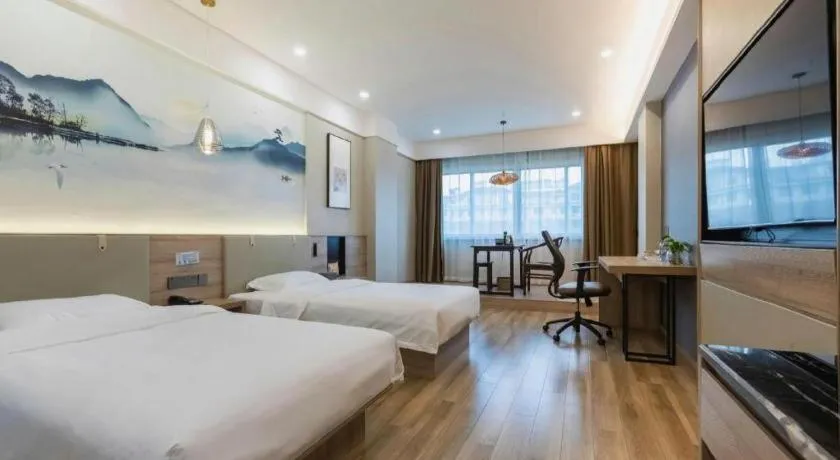 Bed in VX Hotel Jiangsu Taizhou Xinghua RT-Mart