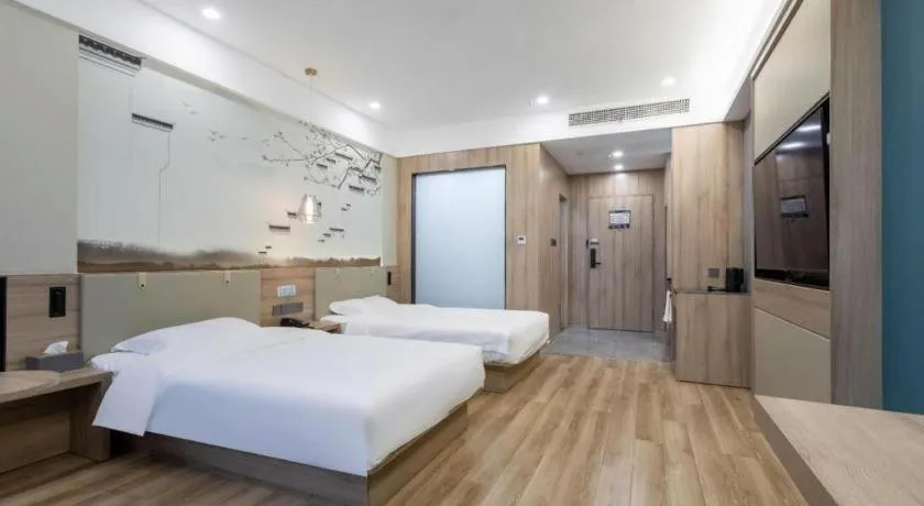 Bed in VX Hotel Jiangsu Taizhou Xinghua RT-Mart