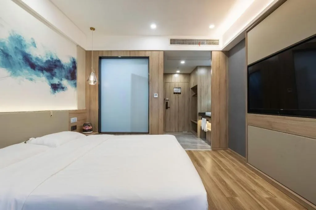 Bed in VX Hotel Jiangsu Taizhou Xinghua RT-Mart