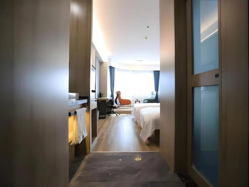 Bed in VX Hotel Jiangsu Taizhou Xinghua RT-Mart