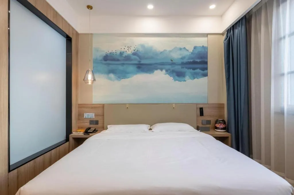 Bed in VX Hotel Jiangsu Taizhou Xinghua RT-Mart