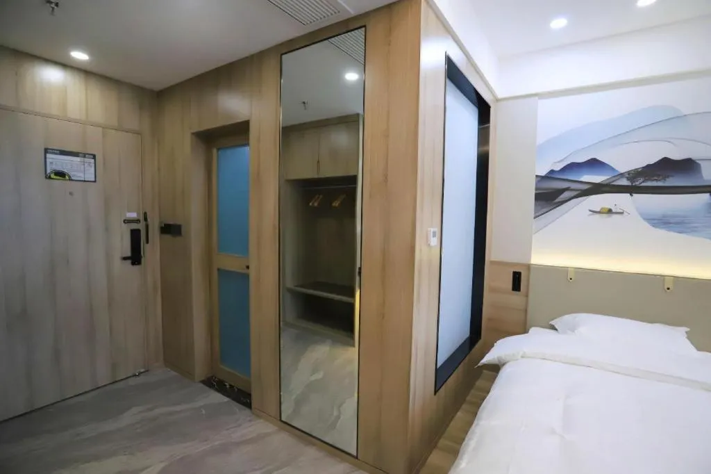 Bed in VX Hotel Jiangsu Taizhou Xinghua RT-Mart