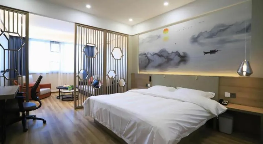 Bed in VX Hotel Jiangsu Taizhou Xinghua RT-Mart