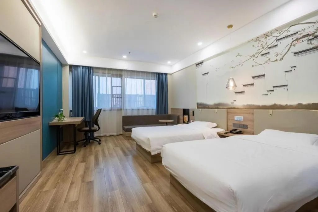 Bed in VX Hotel Jiangsu Taizhou Xinghua RT-Mart