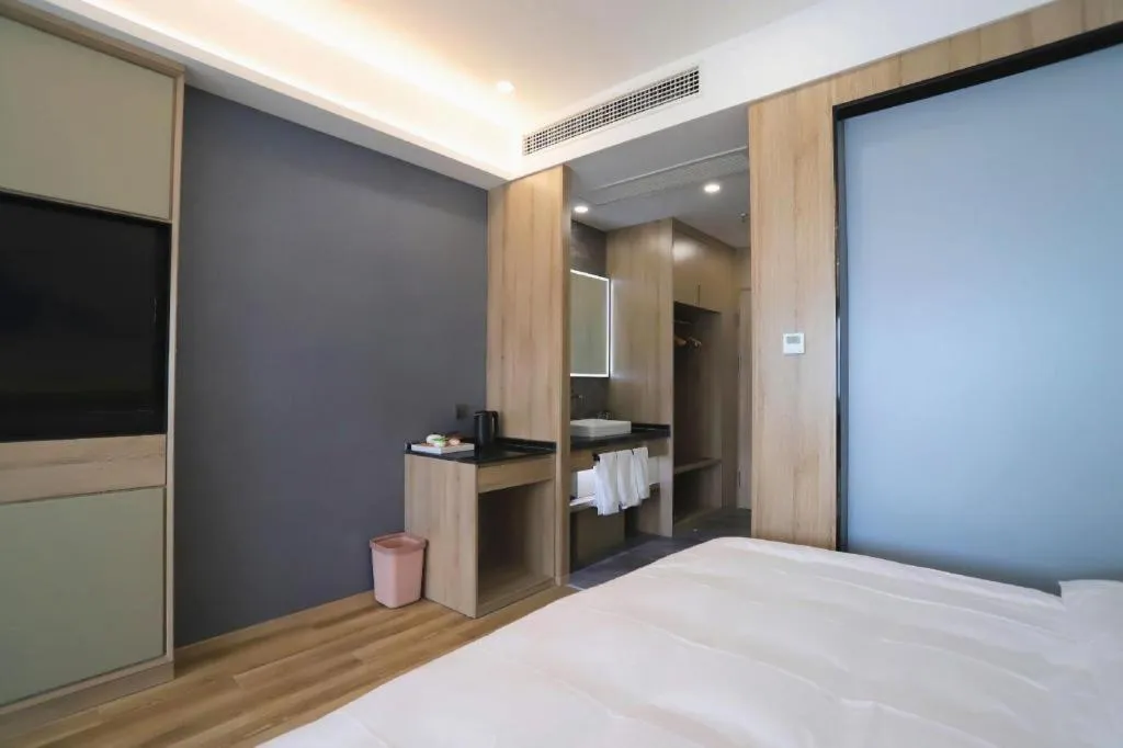 Bed in VX Hotel Jiangsu Taizhou Xinghua RT-Mart