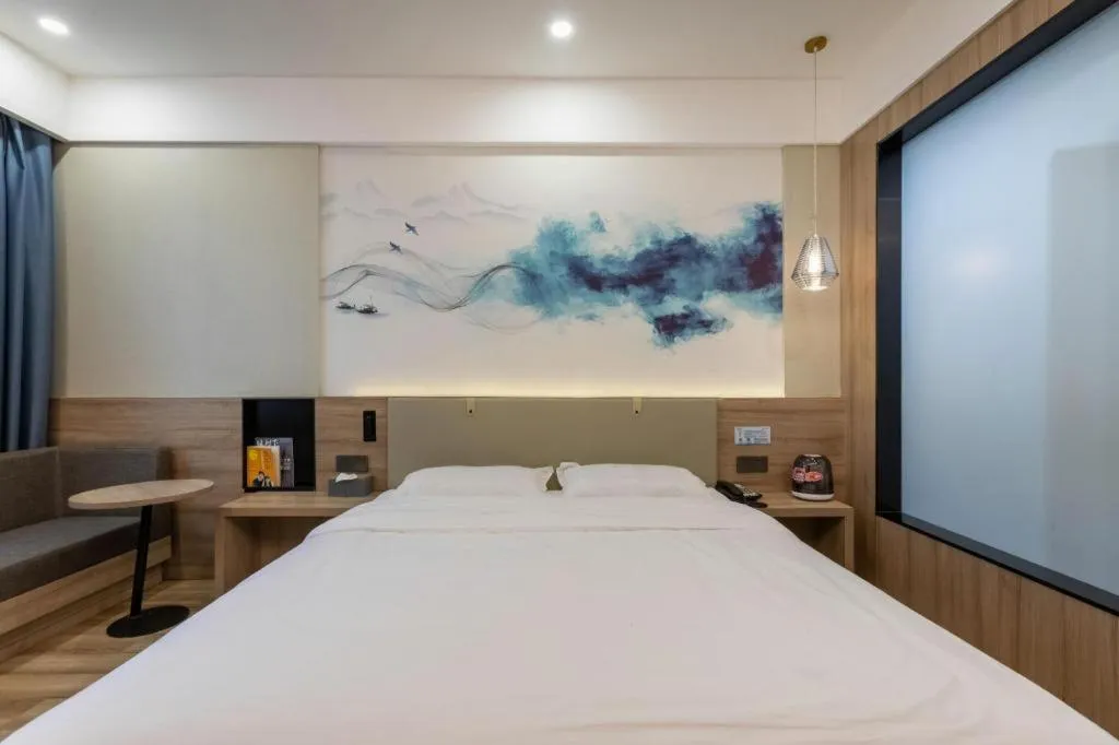 Bed in VX Hotel Jiangsu Taizhou Xinghua RT-Mart