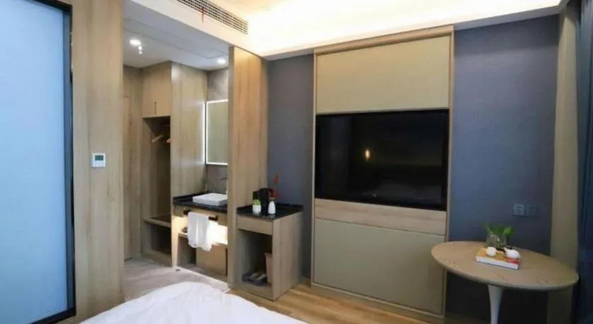 Bed in VX Hotel Jiangsu Taizhou Xinghua RT-Mart