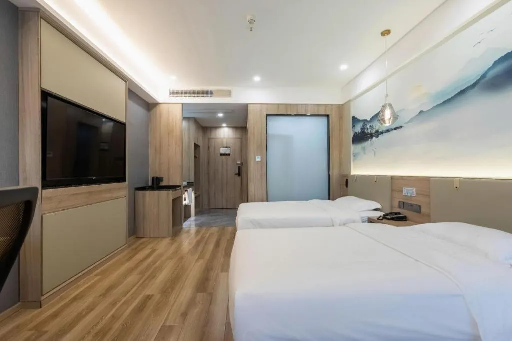 Bed in VX Hotel Jiangsu Taizhou Xinghua RT-Mart