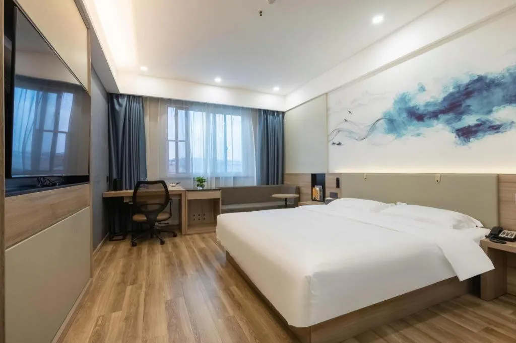 Bed in VX Hotel Jiangsu Taizhou Xinghua RT-Mart