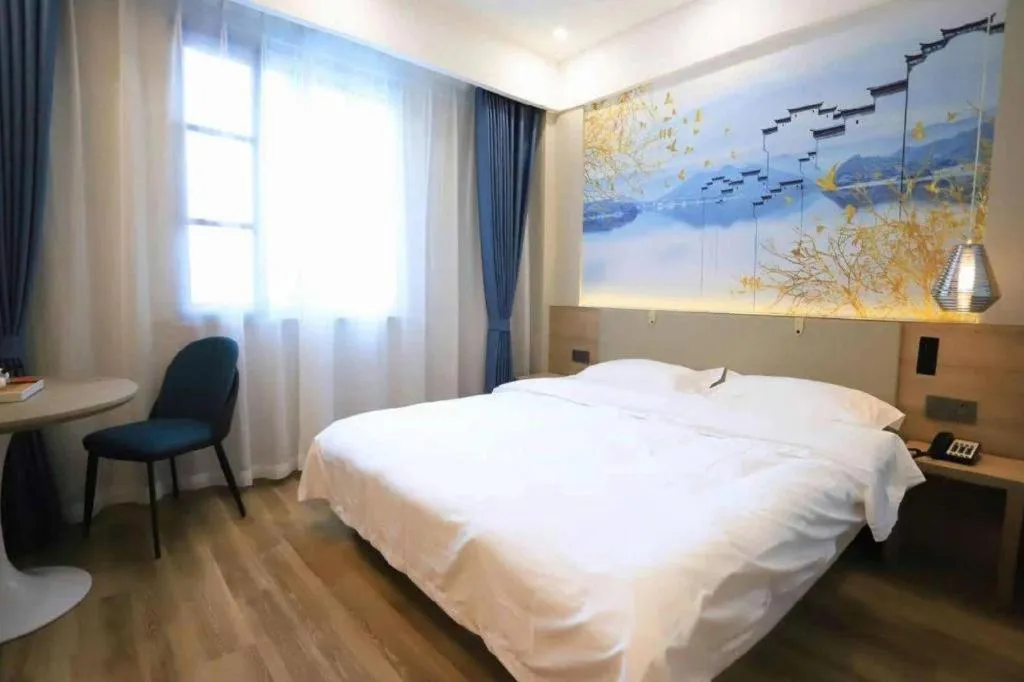 Bed in VX Hotel Jiangsu Taizhou Xinghua RT-Mart