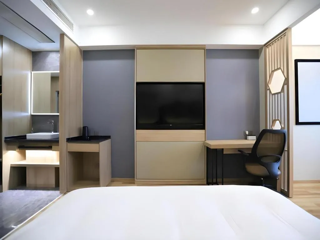 Bed in VX Hotel Jiangsu Taizhou Xinghua RT-Mart