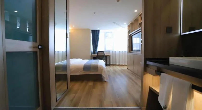 Bed in VX Hotel Jiangsu Taizhou Xinghua RT-Mart