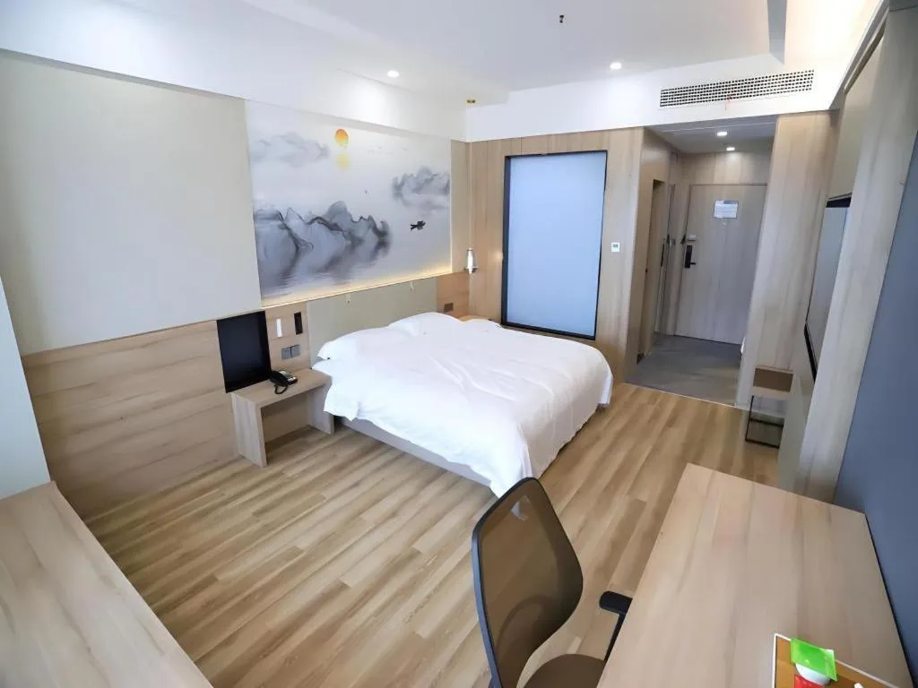 Bed in VX Hotel Jiangsu Taizhou Xinghua RT-Mart