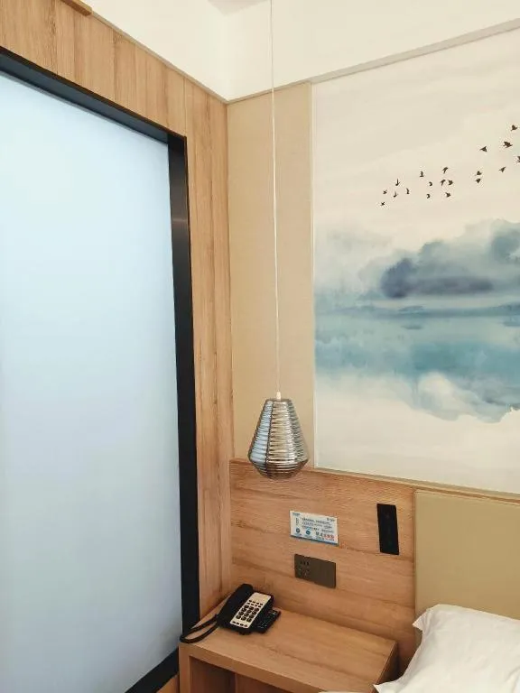 Bed in VX Hotel Jiangsu Taizhou Xinghua RT-Mart