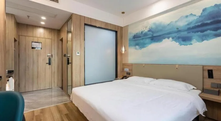 Bed in VX Hotel Jiangsu Taizhou Xinghua RT-Mart