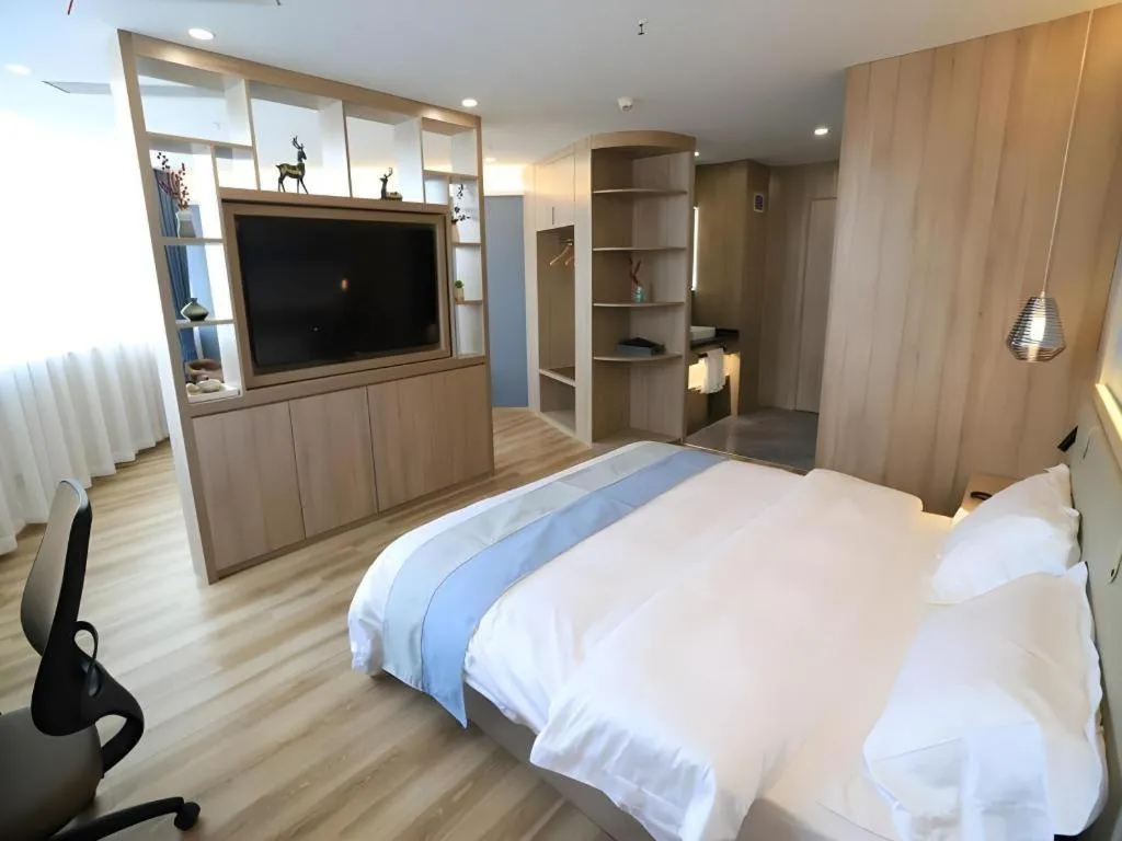 Bed in VX Hotel Jiangsu Taizhou Xinghua RT-Mart