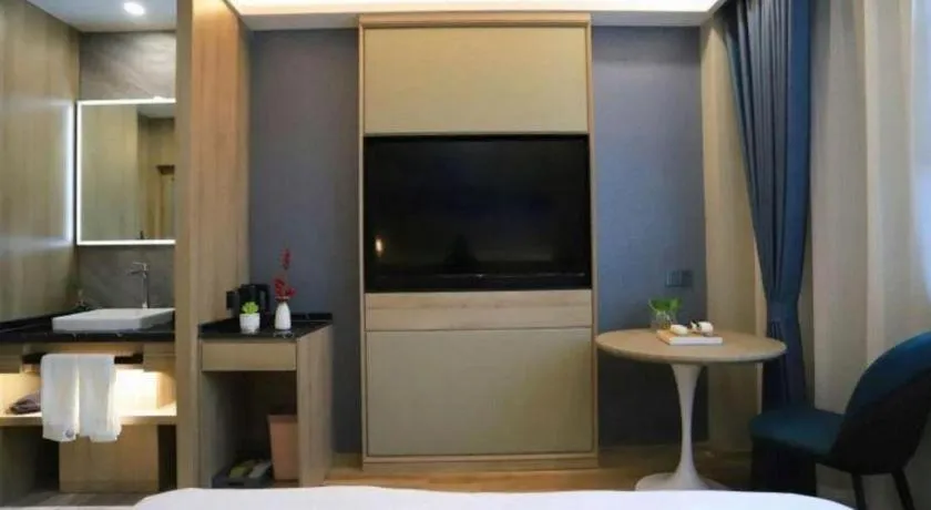 Bed in VX Hotel Jiangsu Taizhou Xinghua RT-Mart