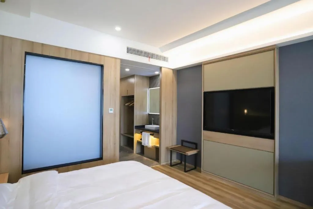 Bed in VX Hotel Jiangsu Taizhou Xinghua RT-Mart