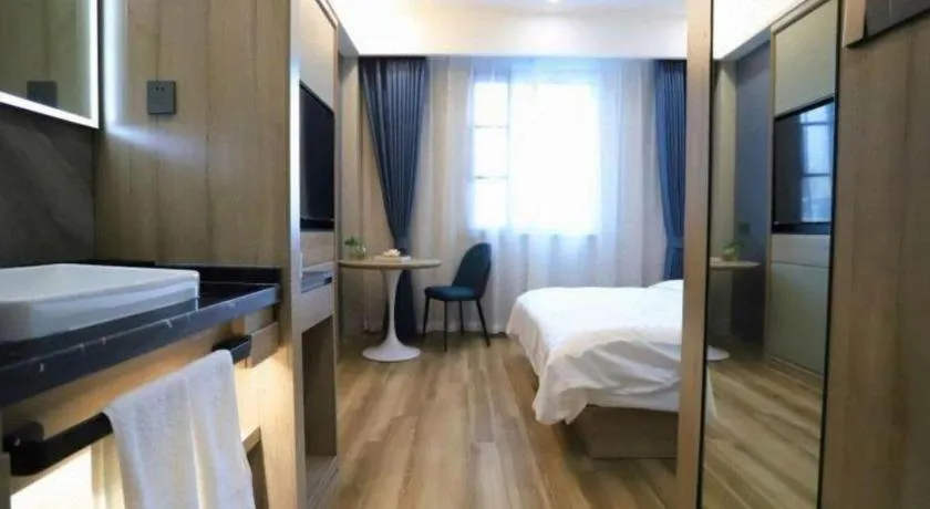 Bed in VX Hotel Jiangsu Taizhou Xinghua RT-Mart