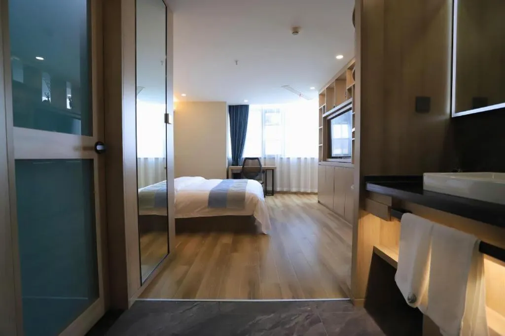 Bed in VX Hotel Jiangsu Taizhou Xinghua RT-Mart